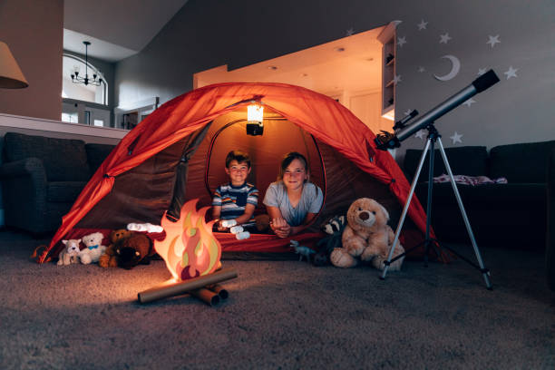 istock Boy and Girl Camping Indoors 1227035112