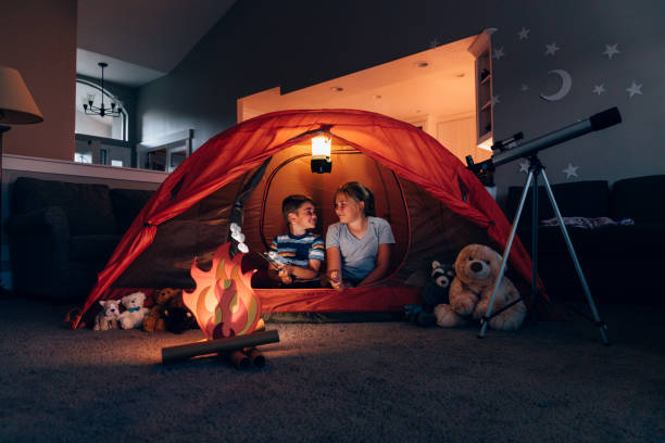 istock Boy and Girl Camping Indoors 1227035133