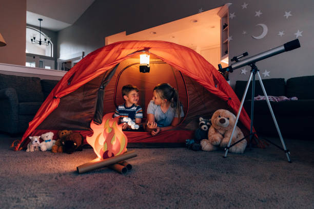 istock Boy and Girl Camping Indoors 1227035137