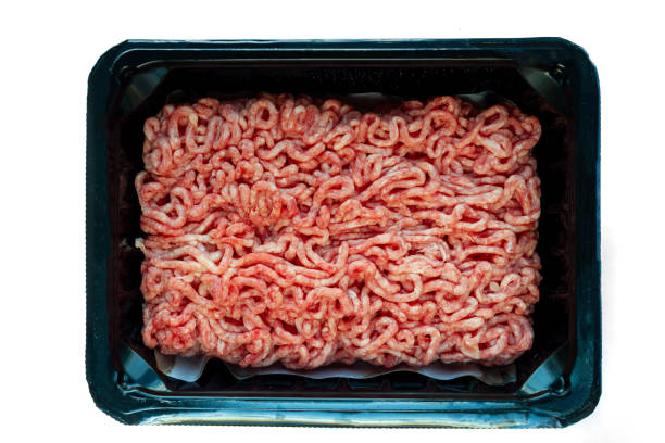 istock Raw minced meat on a plastic black plate, white isolated background 1227036671