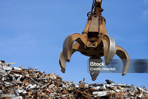 Crane Grabber Up On The Metal Heap Stock Photo - Download Image Now - Scrap Metal, Machinery, Mechanical Grabber