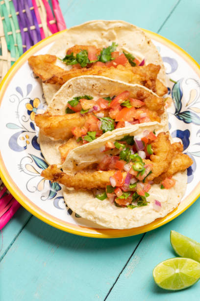 istock Mexican breaded fish tacos also called ensenada on turquoise background 1227037685