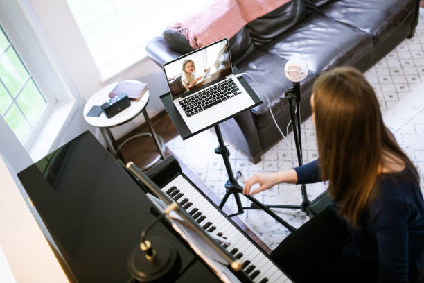 istock Piano Teacher Instructs Student Via Teleconferencing 1227037752