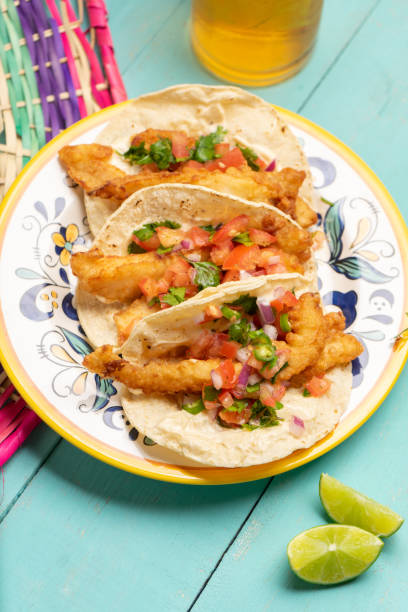 istock Mexican breaded fish tacos also called ensenada on turquoise background 1227037866