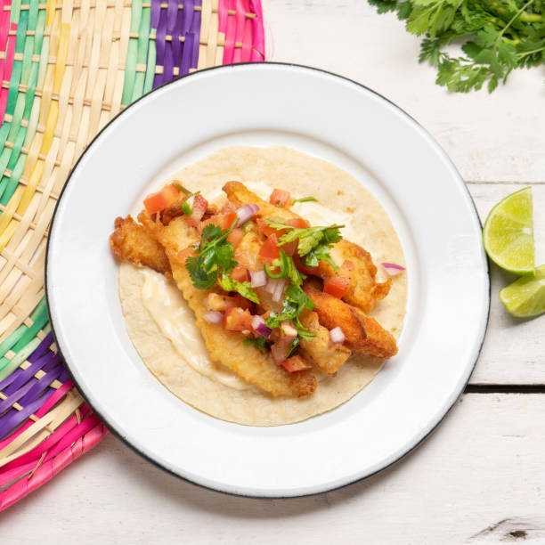 istock Mexican breaded fish tacos also called ensenada on white background 1227037929
