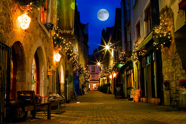 old street decorated with lights and full moon  county galway stock pictures, royalty-free photos & images