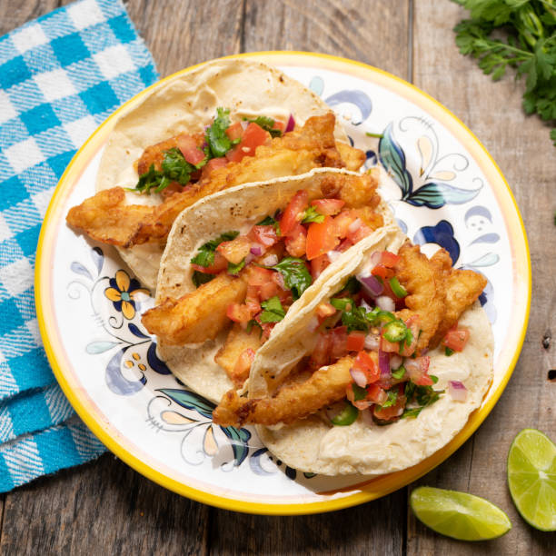 istock Mexican breaded fish tacos also called ensenada on wooden background 1227039274