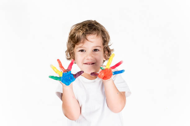 istock Boy Showing Colorful Paint on His Hands 1227039907