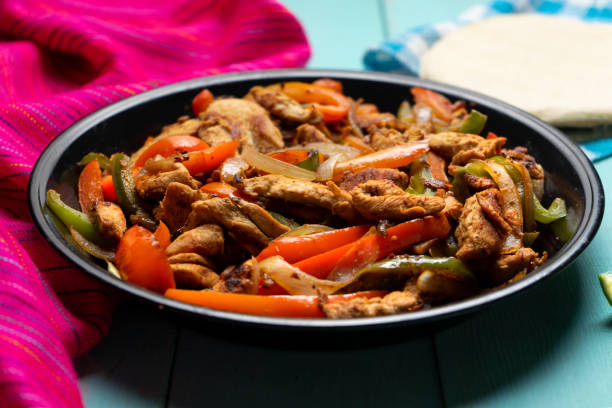 istock Mexican chicken fajitas on turquoise background 1227040266