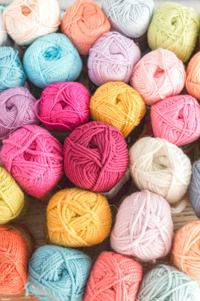 istock Different colours wool in a wooden background 1227042846