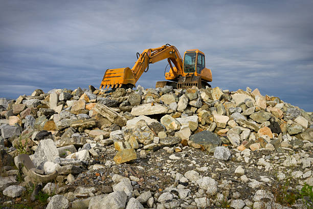 istock excavator on  heap of stones 122704605