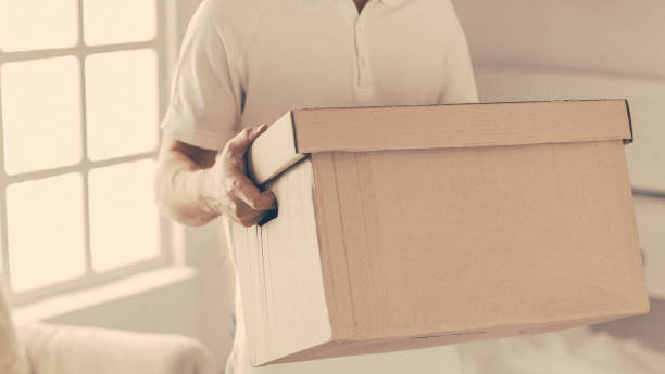 istock close up. a young couple with boxes in a new apartment 1227046424