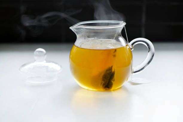 istock Glass Teapot with hot herbal tea 1227046448
