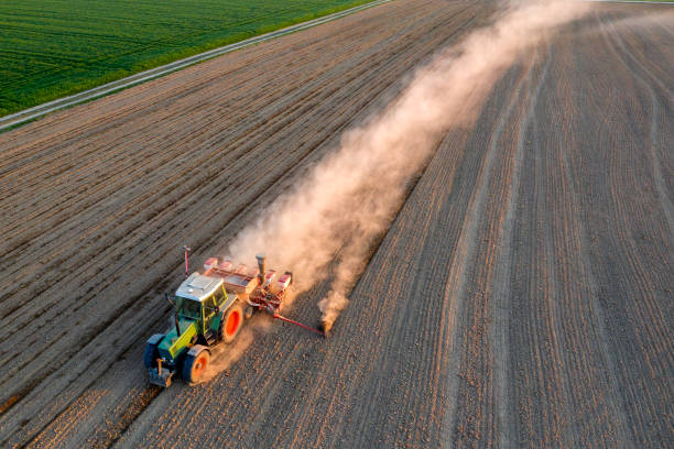 istock Farm Tractor Drilling Seed In Plowed Field 1227046636