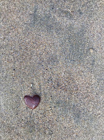 Stone heart on beach