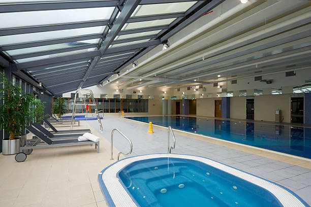 istock swimming pool and chaise-longue with towels 122704905