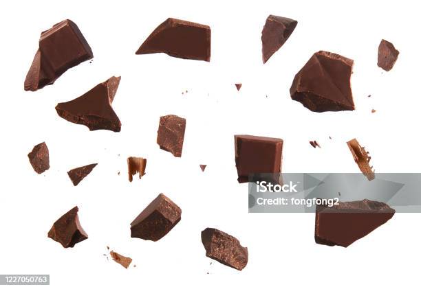 Cracked Chocolate Parts From Top View Isolated On White Background Stock Photo - Download Image Now