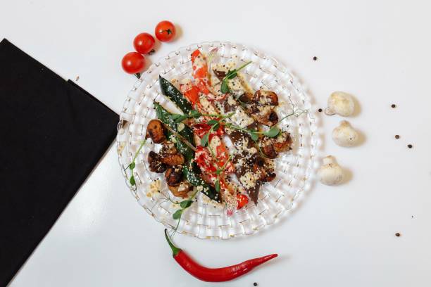 istock Grilled vegetables on a glass plate on a light textured background 1227051390