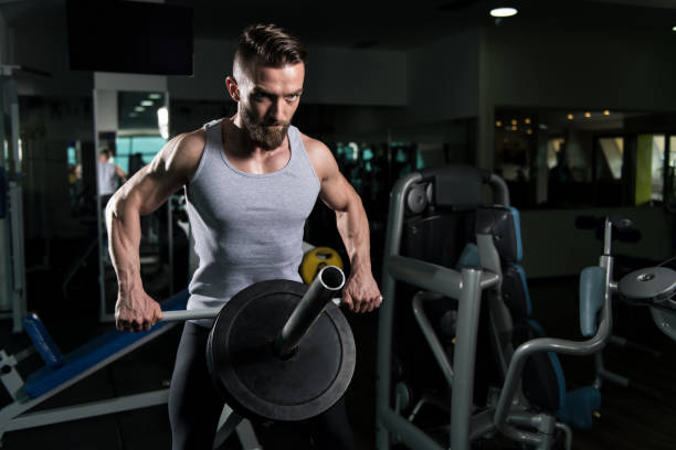 istock Bodybuilder Exercising Back in Gym With Weights 1227051694