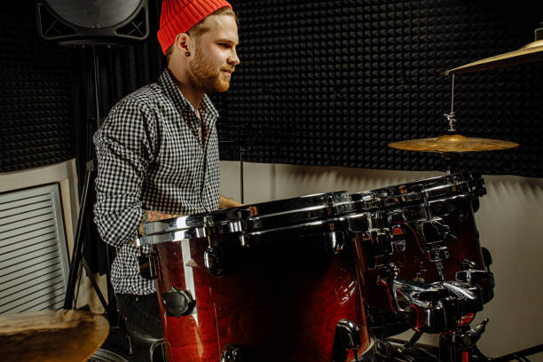 istock modern caucasian man play on drums 1227051719