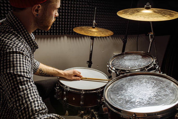 istock young drummer rehearsing on drums before rock concert 1227051790