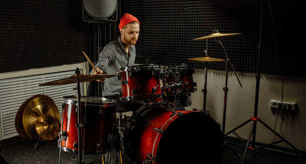 istock young drummer rehearsing on drums before rock concert 1227051796