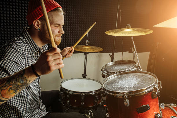 istock young talented man emotionally play the drums 1227052141