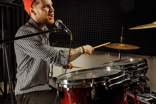 istock amazing caucasian singer play on drums 1227052169
