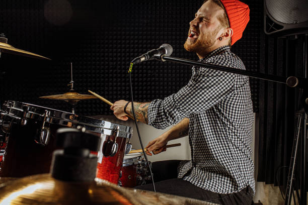 istock modern caucasian man play on drums 1227052173