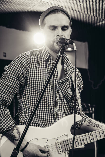 istock handsome caucasian singer with electric guitar 1227053481