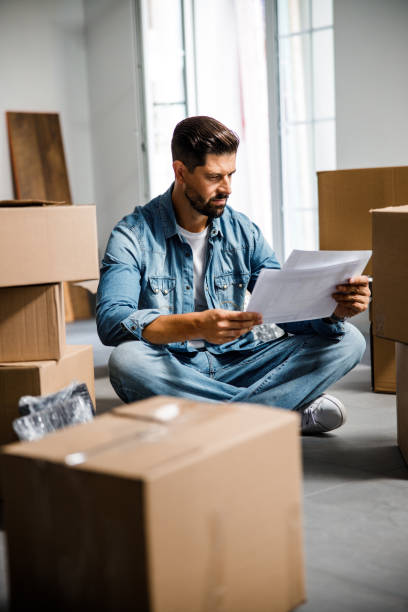 istock Young attractive man studying plan of new flat 1227054381
