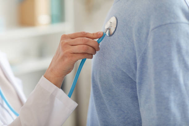 istock Doctor Examining Senior Man Close up 1227059813