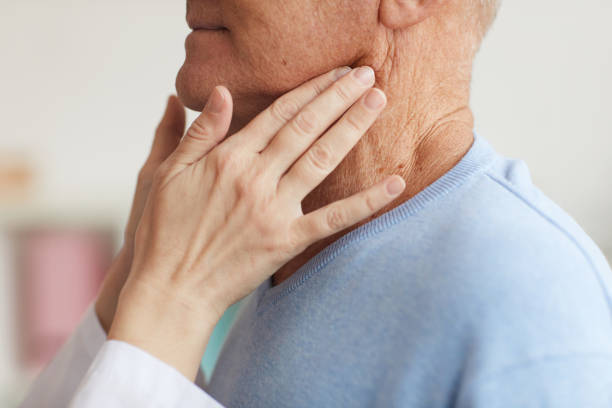 istock Doctor Examining Senior Man Closeup 1227059825