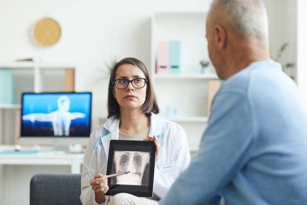 istock Doctor Pointing at X Ray 1227059833