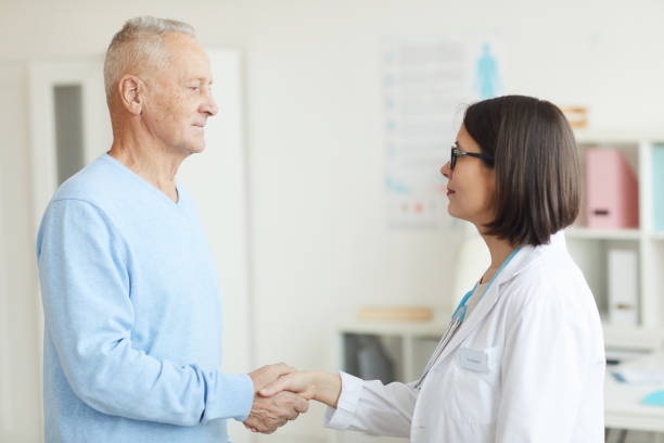 istock Senior Man Shaking Hands with Doctor 1227059835