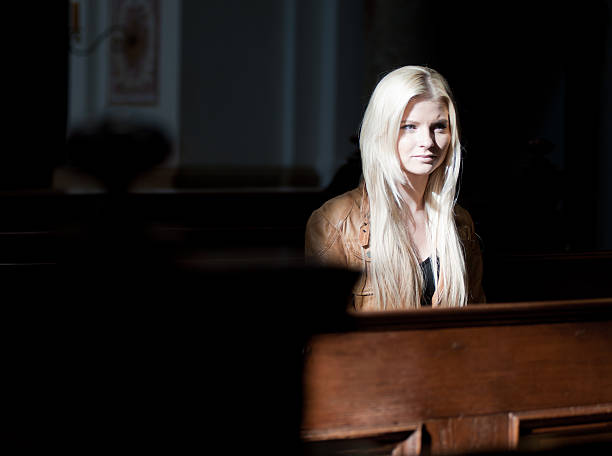 istock Woman sitting in a Church 122706068