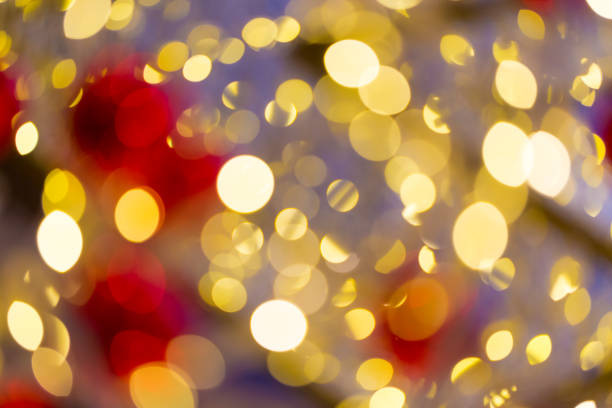 istock Defocused abstract christmas golden bokeh with red color 1227063164