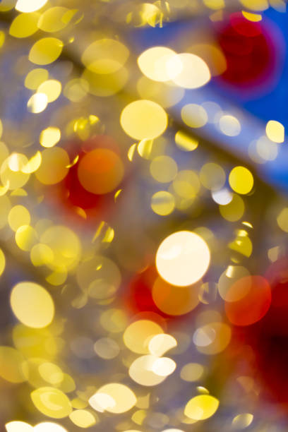 istock Defocused abstract christmas golden bokeh with red color 1227063179