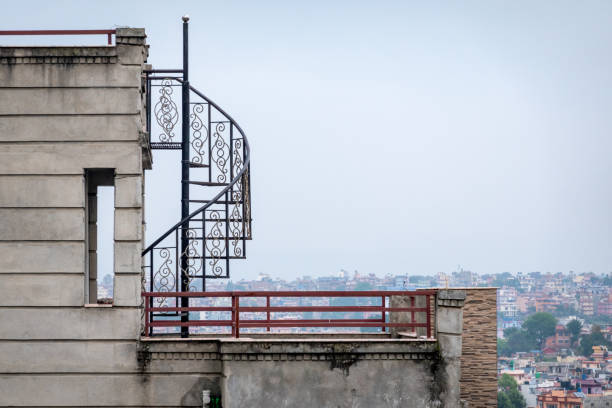 istock Winding Metal Staircase on a Rooftop 1227063399