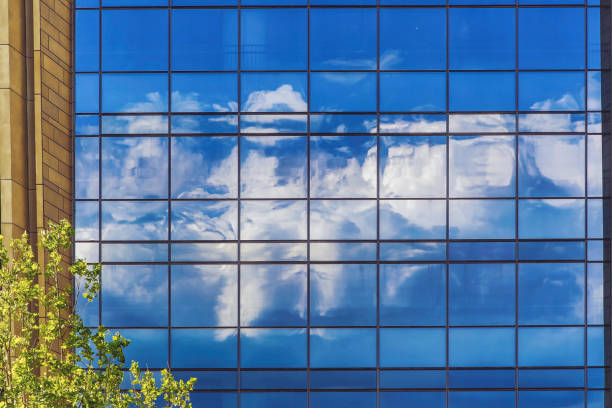 istock Map blue sky and white clouds on modern building glass 1227064947