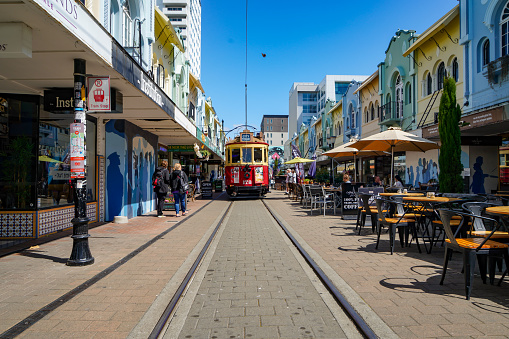 Tram and toursit in city centre, New Regent street, Christchurch, New Zealand.