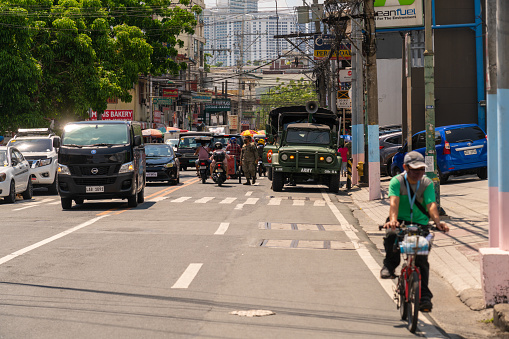 Different mode of transportation can be seen in the street and its mostly bicycle or motorcycle and a private car but the unusual car was also in the road which is the army car to check the area from time to time.