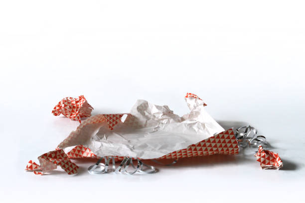 istock Unwrapped Crumpled Gift Wrap Red Isolated on White 1227067093
