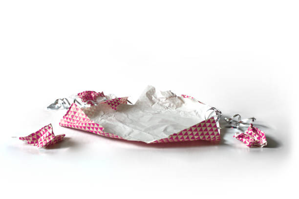 istock Unwrapped Crumpled Gift Wrap Pink Isolated on White 1227068077