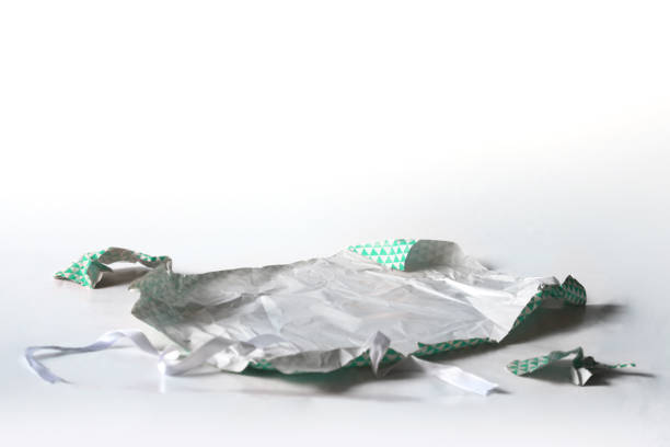 istock Unwrapped Crumpled Gift Wrap Teal Isolated on White 1227068238