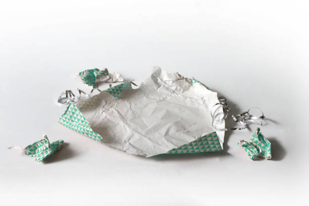 istock Unwrapped Crumpled Gift Wrap Teal Isolated on White 1227068239