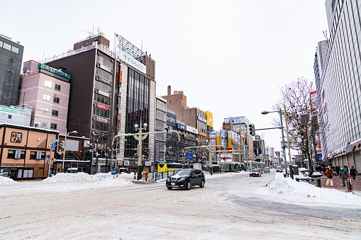 Downtown Sapporo in the winter with snow on the road.