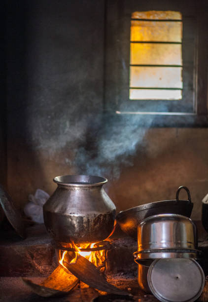 istock Traditional Indian village cooking on fire inside the house 1227076341