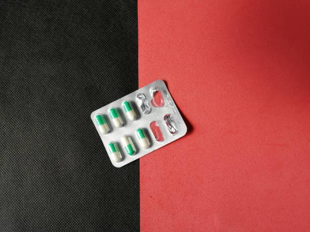 istock Packaging pills for treating a disease 1227080359