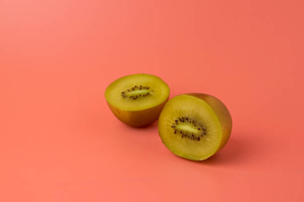 istock Kiwi on pastel red background. Minimal fruit concept. 1227081037